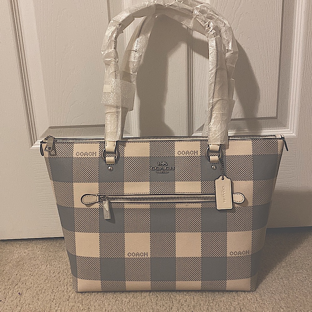 Coach purse, gray & cream. Never used the straps are still protected.